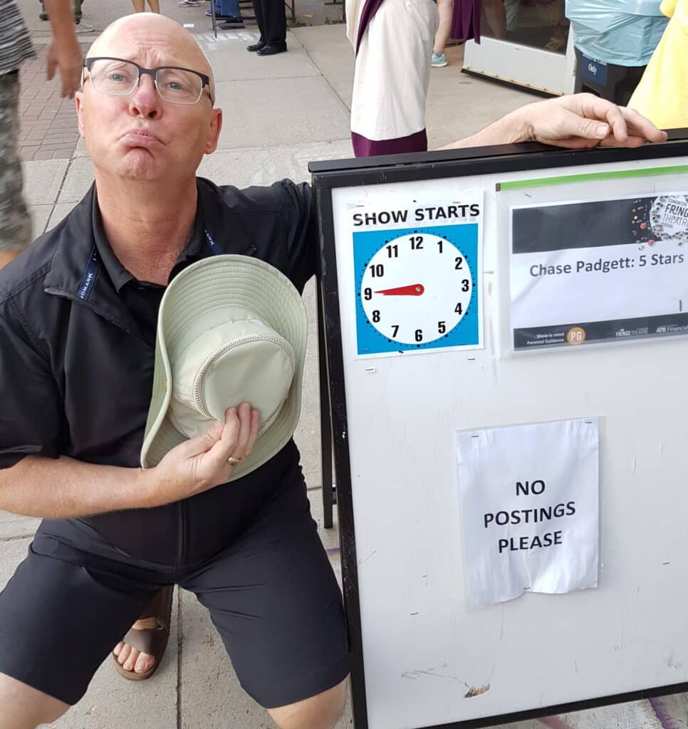 Golden Ticket winner poses with a sign that reads "no postings please"