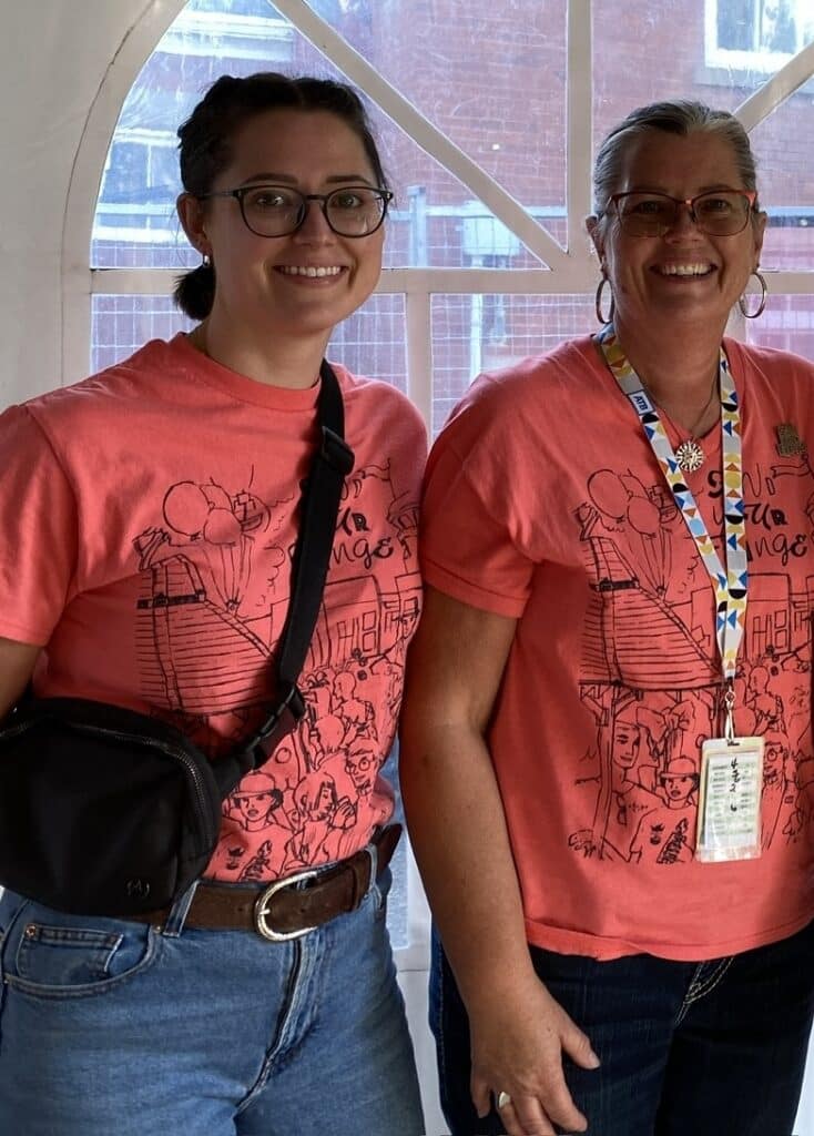 Tammy and Kaytlyn in their volunteer shirts.